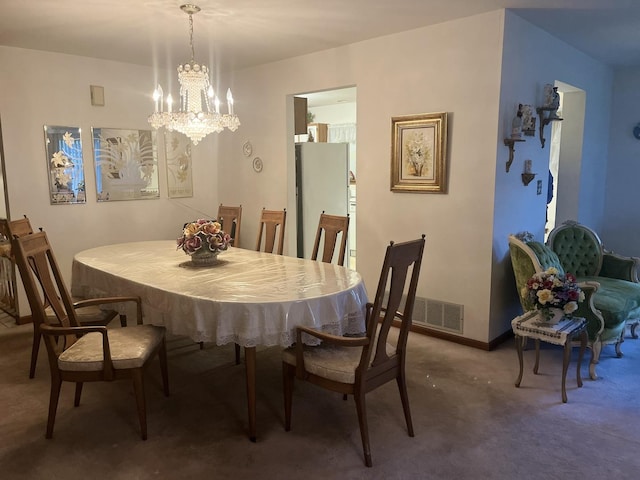 dining space with a notable chandelier