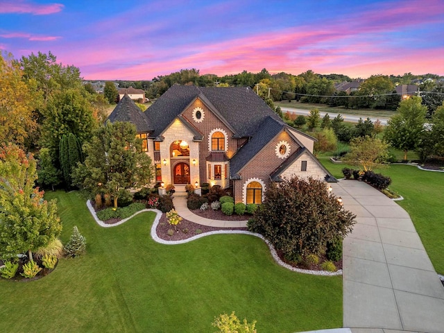 view of front of property with a lawn