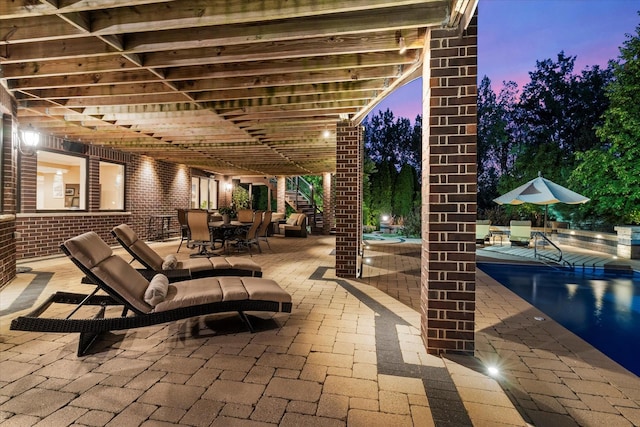 view of patio terrace at dusk