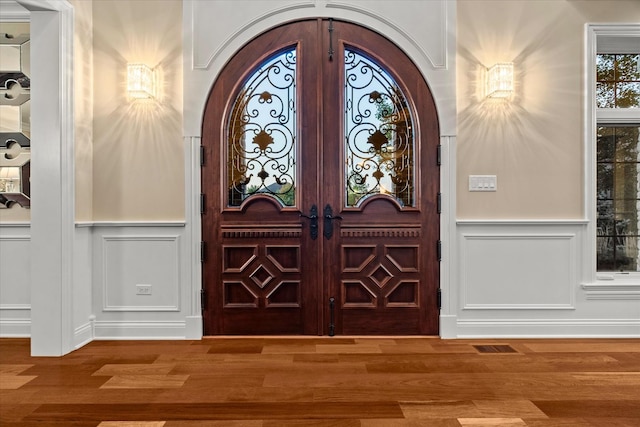 entryway featuring french doors and wood-type flooring