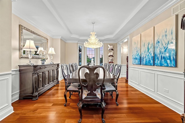 dining area featuring a chandelier and light wood-type flooring