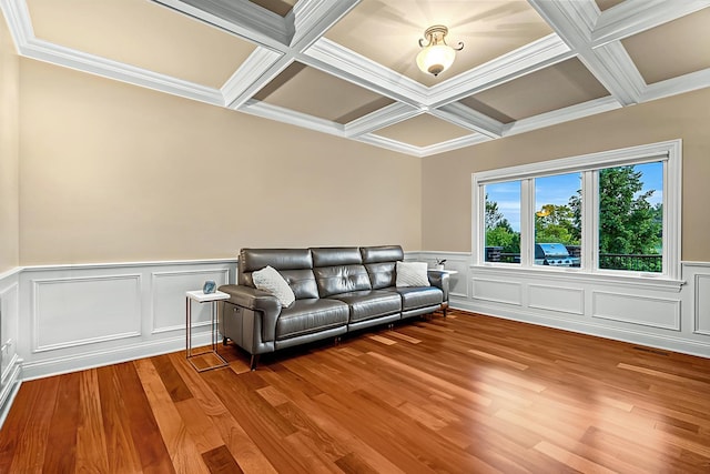 living room featuring beam ceiling, ornamental molding, and coffered ceiling