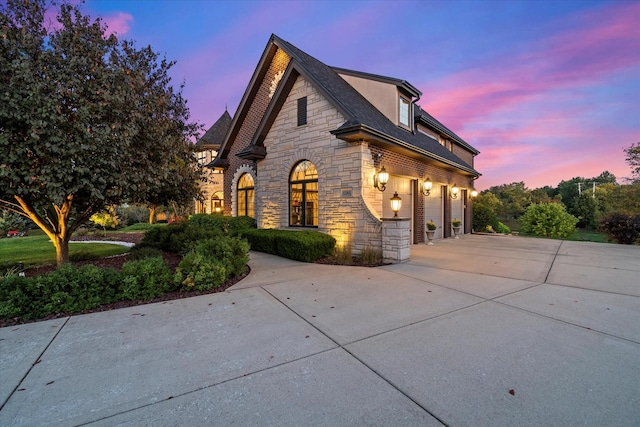 property exterior at dusk with a garage