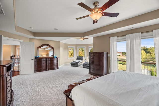 bedroom featuring access to outside, ceiling fan, and carpet floors