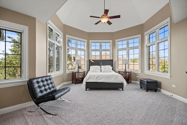 bedroom featuring carpet flooring, ceiling fan, and multiple windows