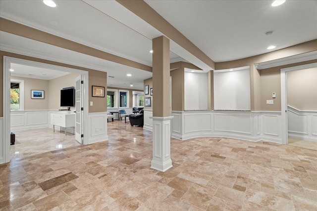 interior space featuring plenty of natural light and crown molding