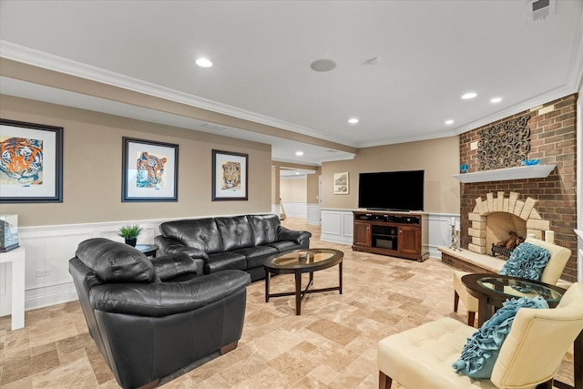 living room featuring ornamental molding and a brick fireplace