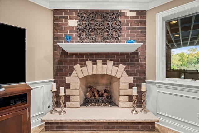 details with a fireplace and ornamental molding