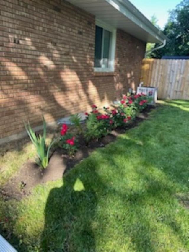 view of property exterior with a lawn