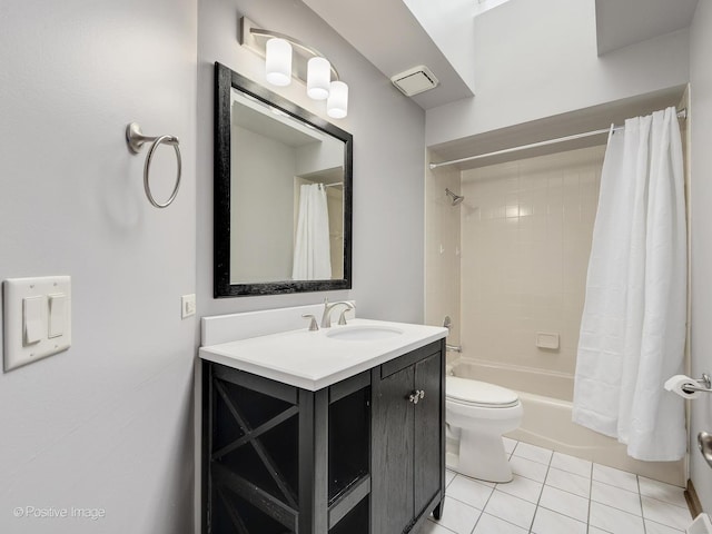 full bathroom with tile patterned flooring, shower / bath combination with curtain, vanity, and toilet