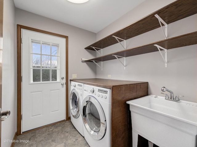 laundry room featuring sink and washer and dryer