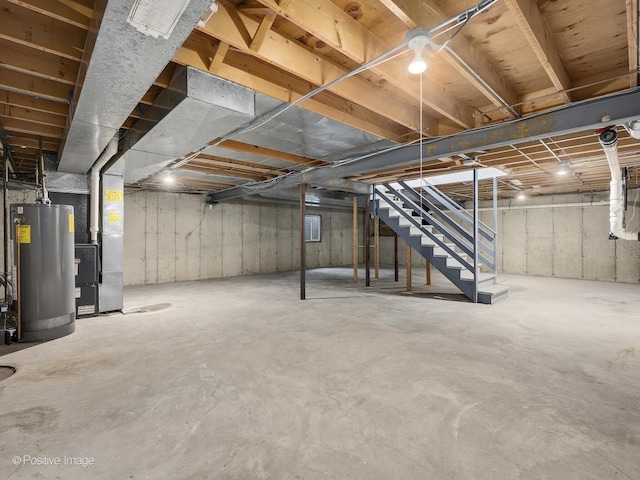 basement featuring heating unit and gas water heater