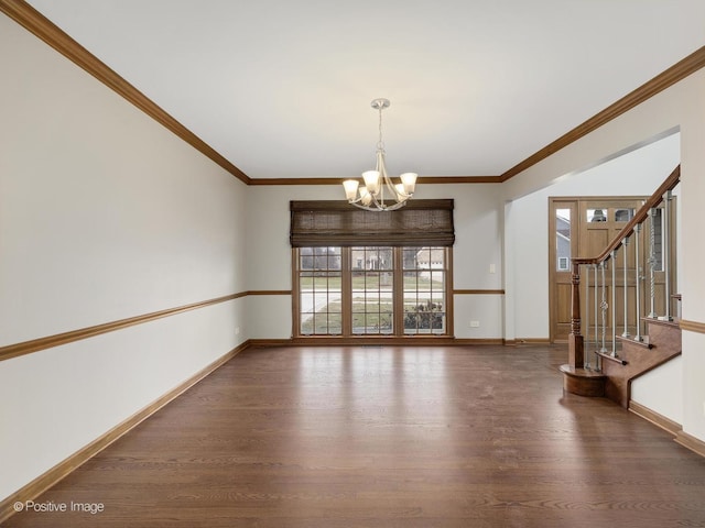 interior space with ornamental molding, dark wood-type flooring, and an inviting chandelier