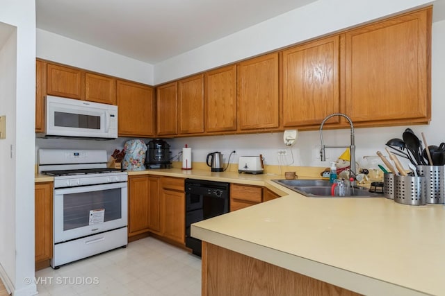 kitchen featuring white appliances and sink