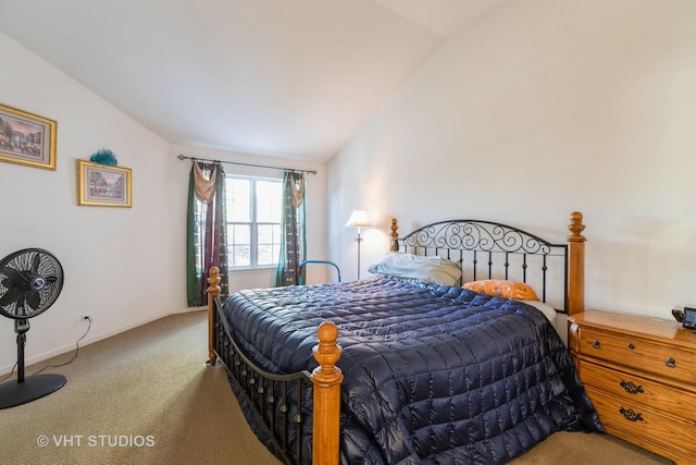 carpeted bedroom with lofted ceiling