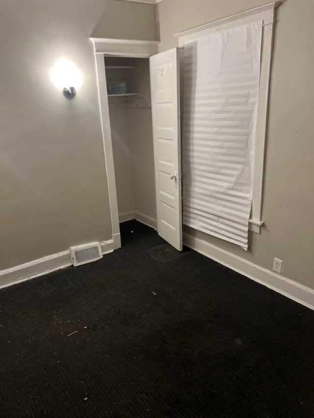 unfurnished bedroom with a closet