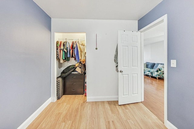 corridor featuring light wood-type flooring