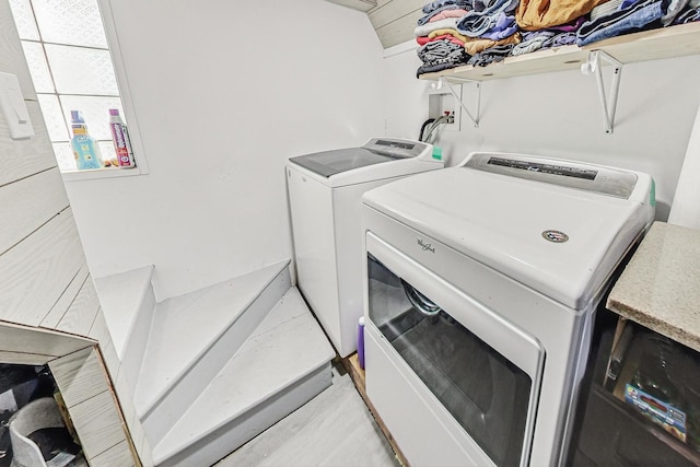 laundry room featuring washing machine and clothes dryer