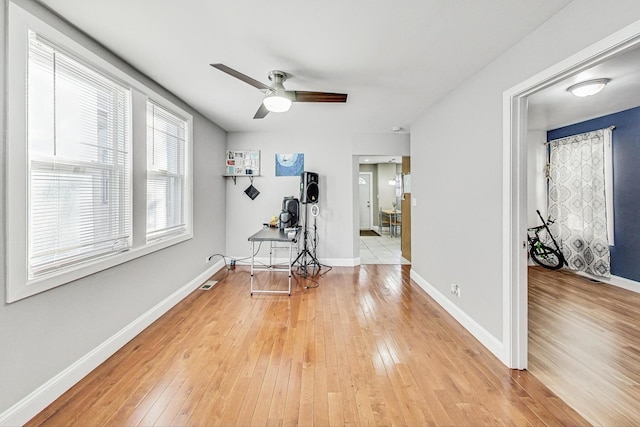 interior space with hardwood / wood-style flooring and ceiling fan