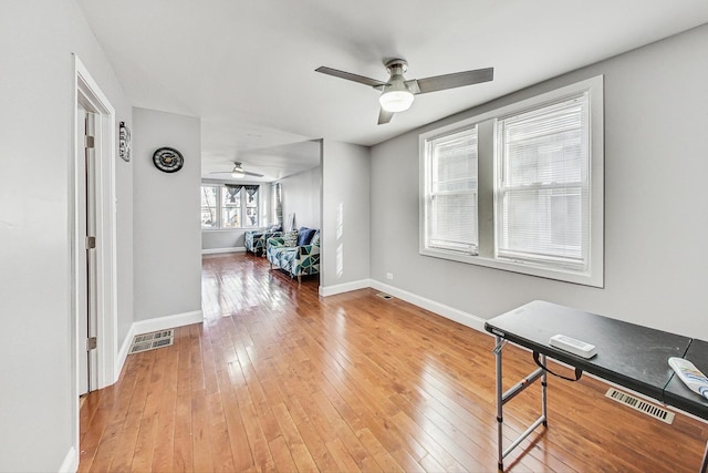 interior space featuring hardwood / wood-style flooring and ceiling fan