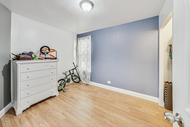 bedroom with light wood-type flooring