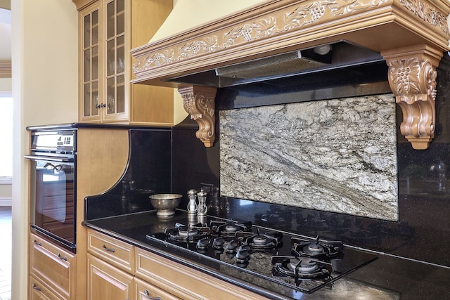 kitchen with dark stone countertops, black appliances, and custom range hood