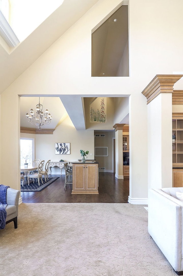 living room with a notable chandelier and wood-type flooring