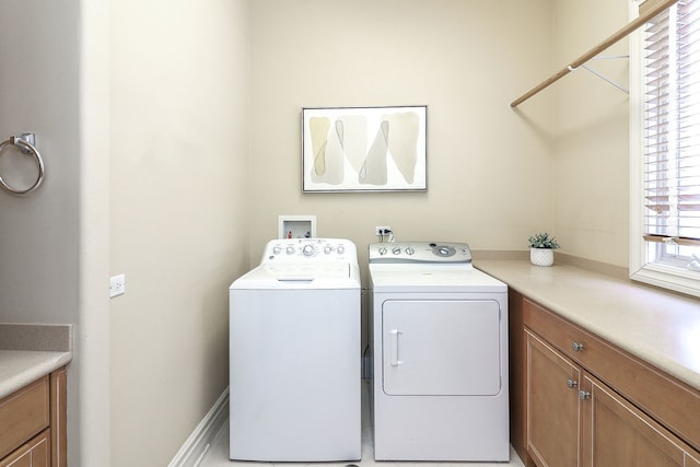 laundry room featuring separate washer and dryer