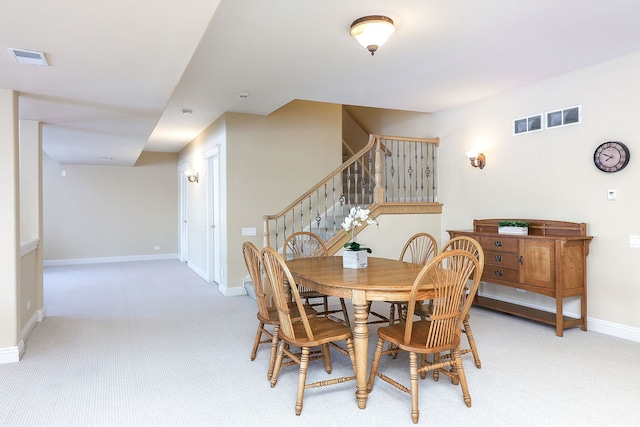 dining area with light colored carpet