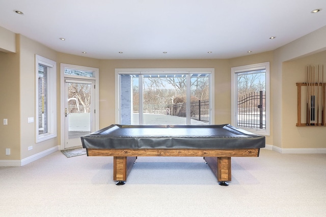 rec room with pool table, a wealth of natural light, and light colored carpet