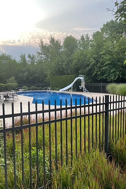 view of swimming pool featuring a water slide