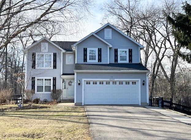 front of property with a garage