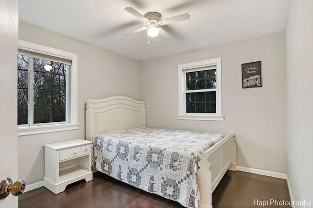 bedroom with ceiling fan and dark hardwood / wood-style flooring