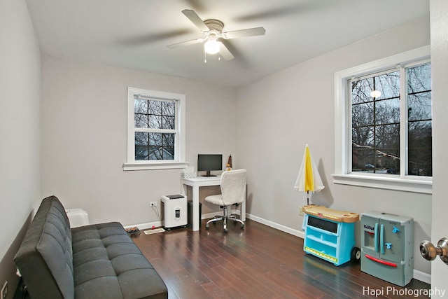 home office with ceiling fan and dark wood-type flooring