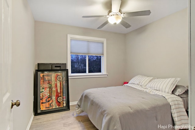 bedroom with ceiling fan and light hardwood / wood-style flooring