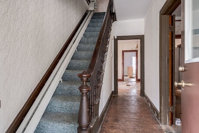 stairs with hardwood / wood-style floors