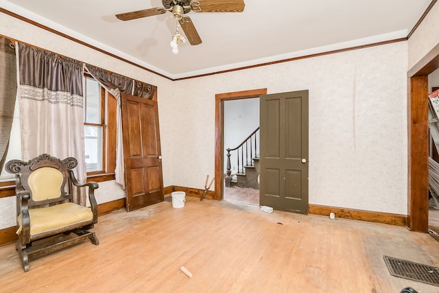 sitting room featuring ceiling fan, hardwood / wood-style floors, and ornamental molding