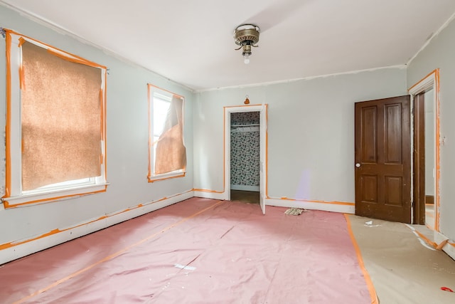 unfurnished bedroom with baseboard heating