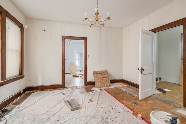 spare room featuring a notable chandelier