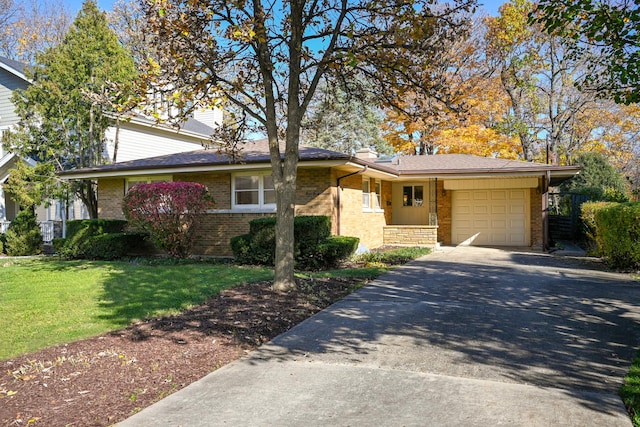 view of front facade featuring a front yard and a garage