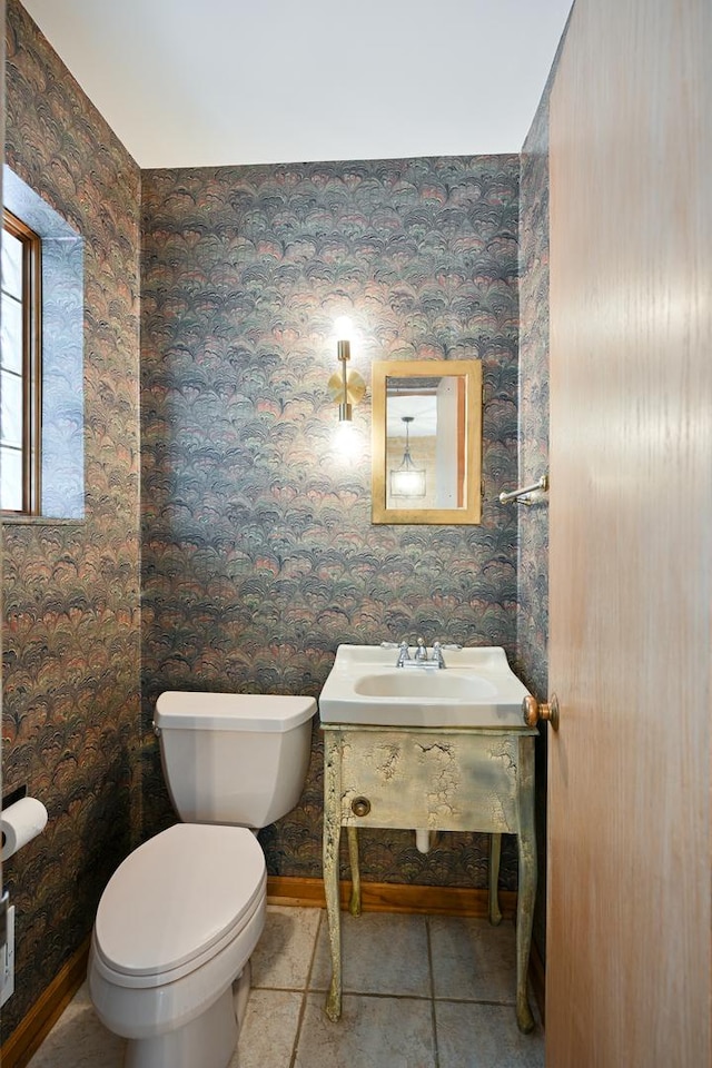 bathroom featuring tile patterned floors, vanity, and toilet