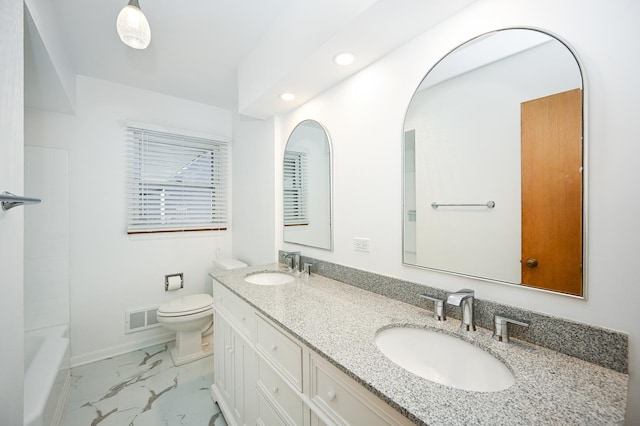 bathroom with vanity and toilet