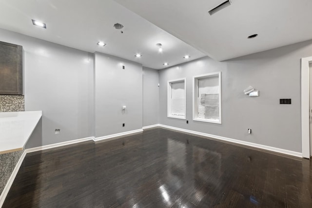 unfurnished room with hardwood / wood-style flooring