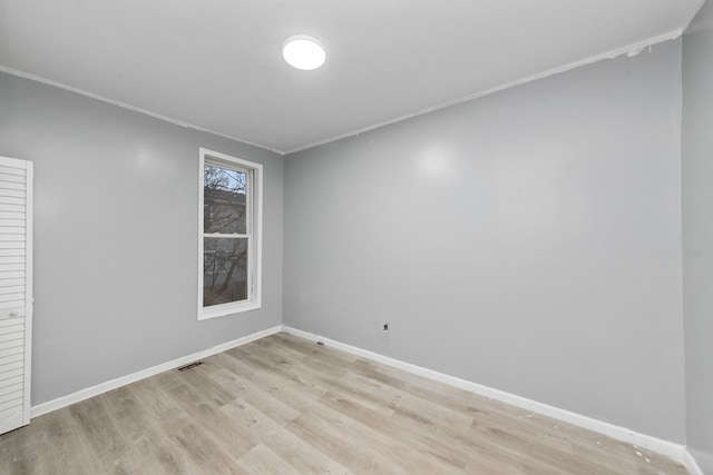 empty room with light hardwood / wood-style floors