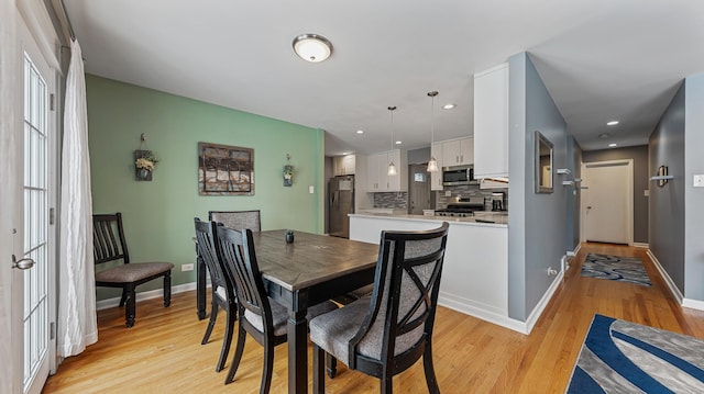 dining room with light wood-type flooring