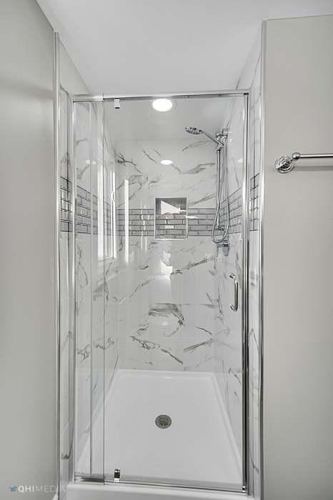 bathroom with an enclosed shower