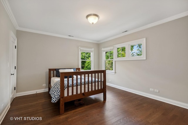 bedroom featuring dark hardwood / wood-style flooring and crown molding