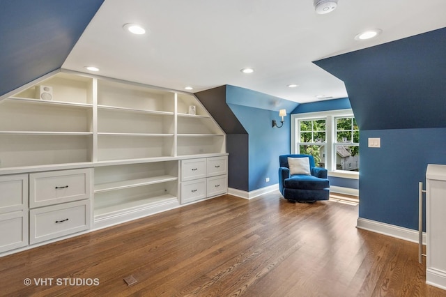 unfurnished room with vaulted ceiling and dark hardwood / wood-style floors