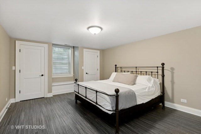 bedroom featuring dark wood-type flooring