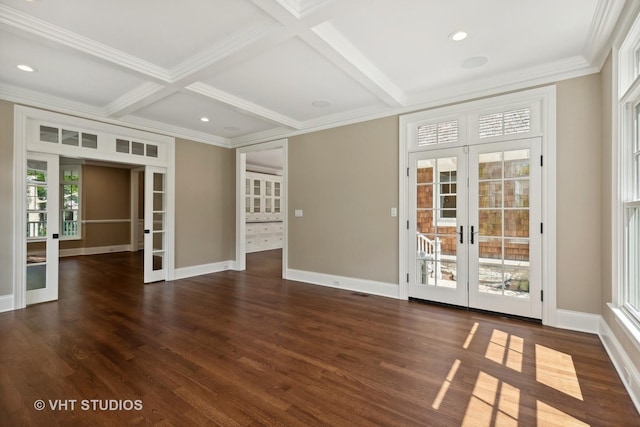 unfurnished room featuring coffered ceiling, dark hardwood / wood-style flooring, beam ceiling, and french doors